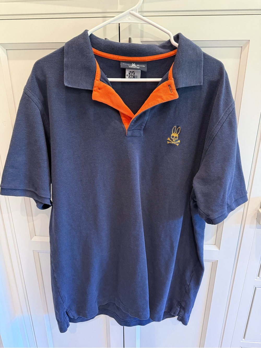 Psycho Bunny Navy Polo with Orange Inner Placket and Yellow Logo